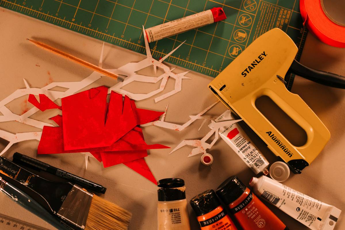 Hands using a clear plastic protractor to measure the angle of a holiday garland on a mantel for seasonal item protractor how to use